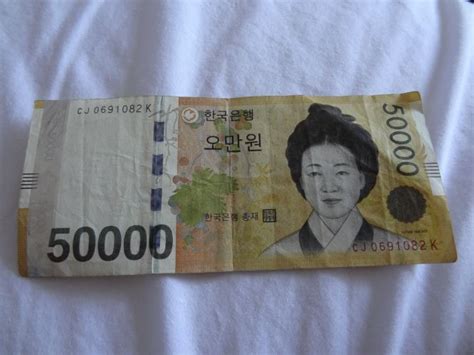 一万人民币在韩国玩几天，5千万韩元在韩国能呆多久
