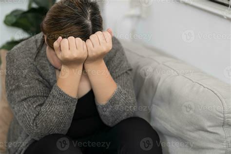 Sad Overweight plus size woman thinking about problems on sofa upset ...
