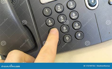 Man Dialing Number on Telephone at Table Stock Photo - Image of ...