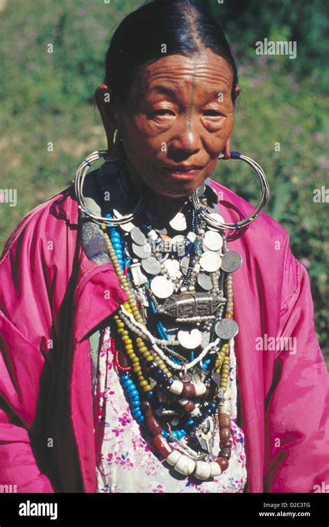 Miji tribe couple with traditional dress with large knife , Arunachal ...