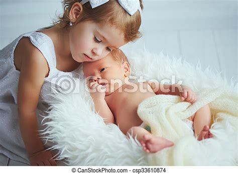 Children sister and brother newborn baby on a light background. | CanStock