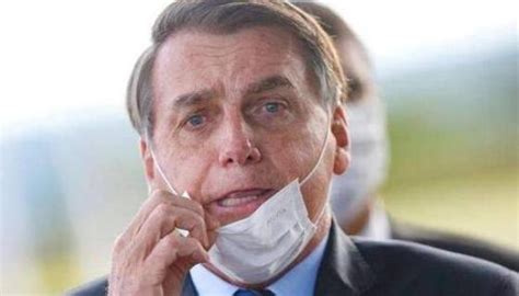 巴西总统确诊后面对记者摘口罩：让记者们看清自己的脸
