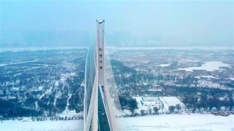 航拍雪中黑龙江哈尔滨牡丹江大桥mov格式视频下载_正版视频编号171284-摄图网