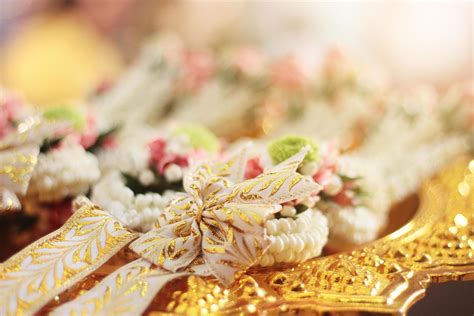 Flower garlands on a gold tray in tradition Thai wedding ceremony day ...