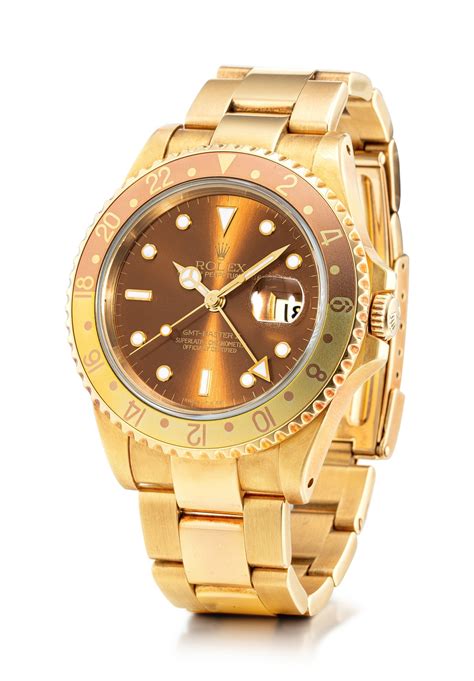 ROLEX | GMT-MASTER II, REFERENCE 16718, A YELLOW GOLD WRISTWATCH WITH ...