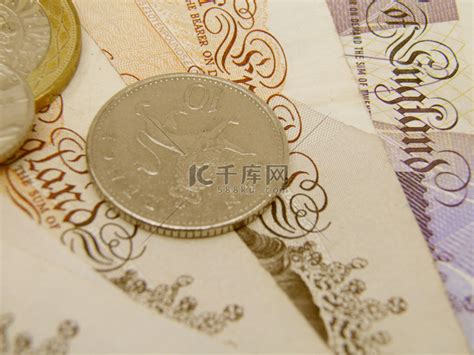 英国英镑货币纸币和硬币高清摄影大图-千库网