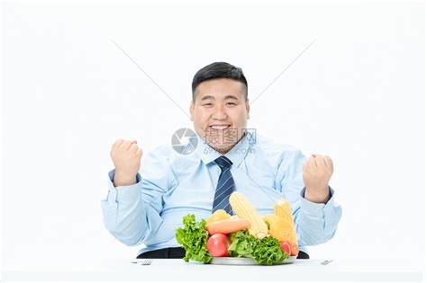 商务肥胖男性吃蔬菜高清图片下载-正版图片501413788-摄图网