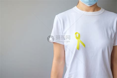 佩戴黄丝带预防癌症概念高清图片下载-正版图片308021464-摄图网