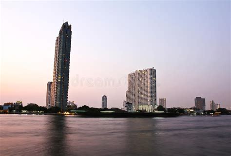 Buildings along the river. stock photo. Image of evening - 30834448
