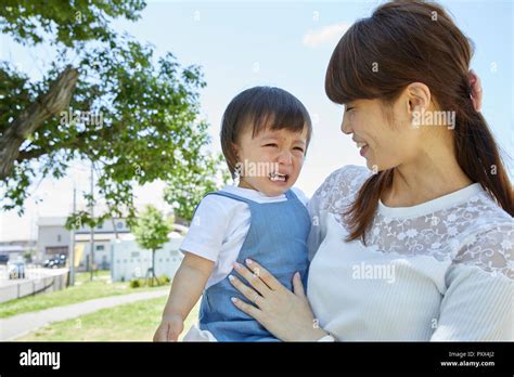 Japanese mother and son at the park Stock Photo - Alamy