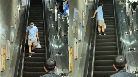 广州一大叔反向乘扶梯原地踏步 目击者：应该是被雨淋懵了_腾讯视频