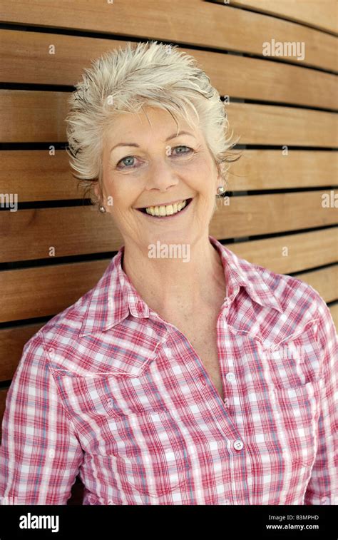 Attractive mature older woman with a healthy happy smile and youthful ...