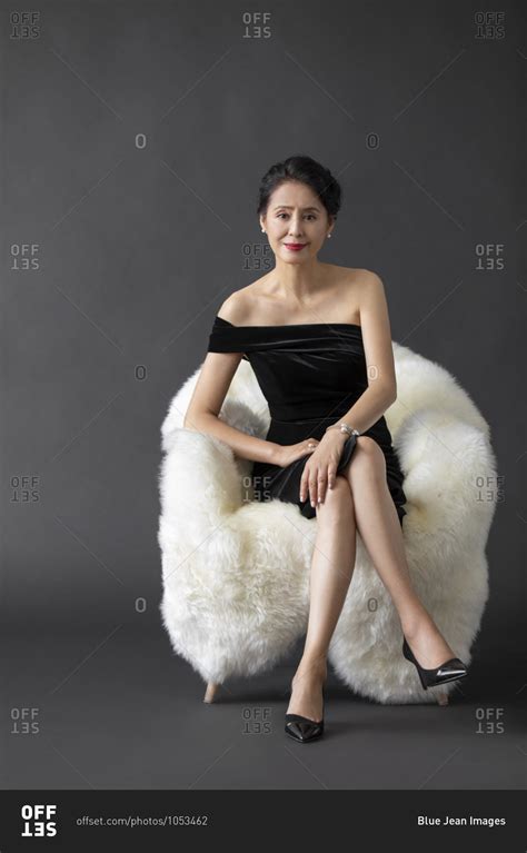 A beautiful mature Chinese woman stock photo - OFFSET
