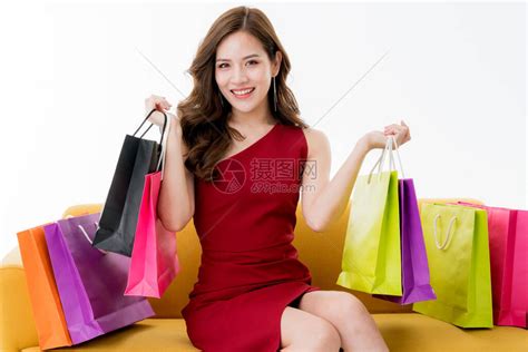 有许多购物袋的美丽魅力亚洲女享受购物和快乐有趣的表演高清图片下载-正版图片506424695-摄图网