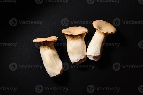 Pleurotus eryngii also known as king trumpet mushroom on black 3358974 ...