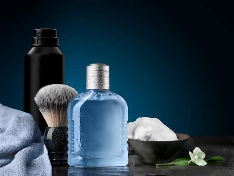 Premium Photo | Shaving accessories set on a blue dark background mockup