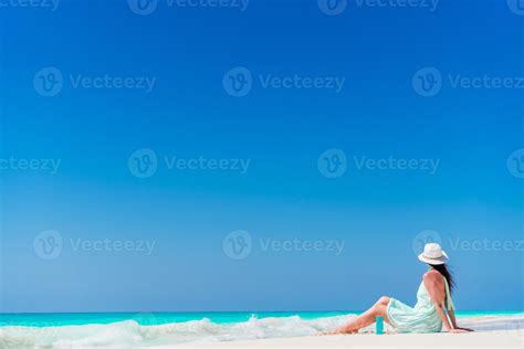 Young woman in hat on the beach 18108425 Stock Photo at Vecteezy