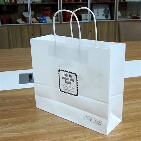 纸袋定做化妆品礼品包装袋现货服装购物手提牛皮纸袋定制logo-阿里巴巴