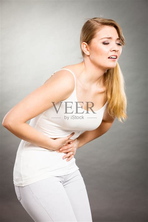 女人肚子痛。照片摄影图片_ID:300204456-Veer图库