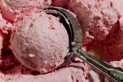 Premium Photo | A scoop of strawberry ice cream with a scoop on it