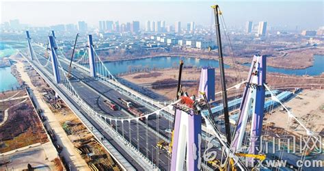 尧都区尧贤街北延工程跨洰河大桥最后一个桥冠完成吊装_临汾新闻网