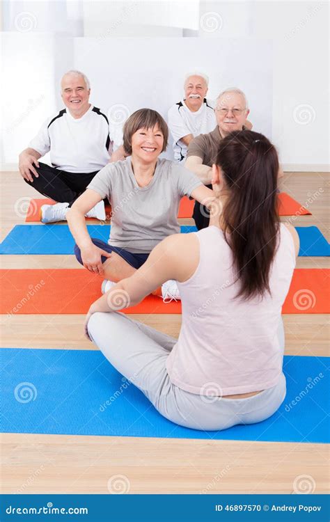 Trainer Training Customers in Yoga Class Stock Photo - Image of senior ...
