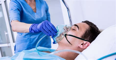 Patient receiving oxygen treatment - Stock Photo - Dissolve